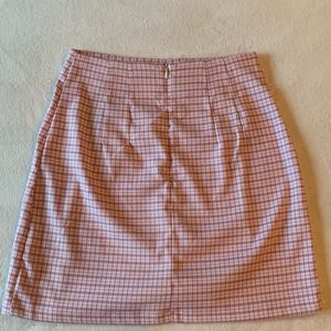 Brandy Melville pink and white plaid skirt.